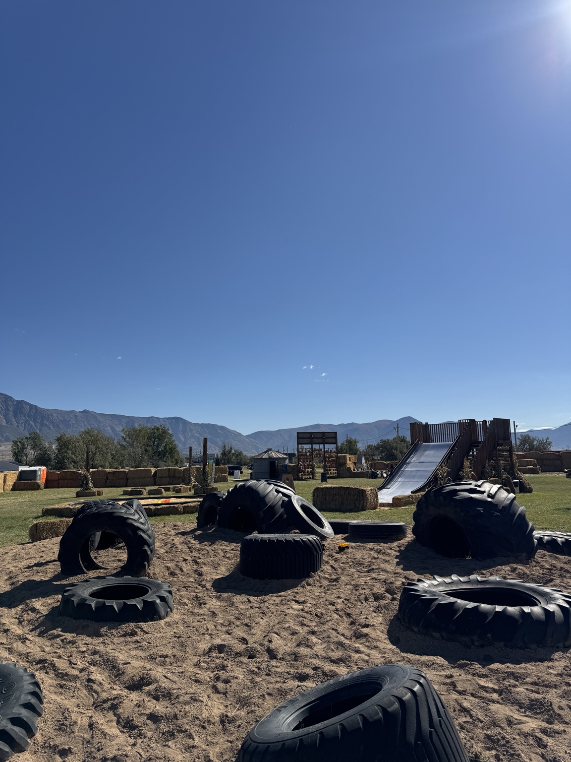 Tractor-tire play area and large slide at Hunt Family Farm