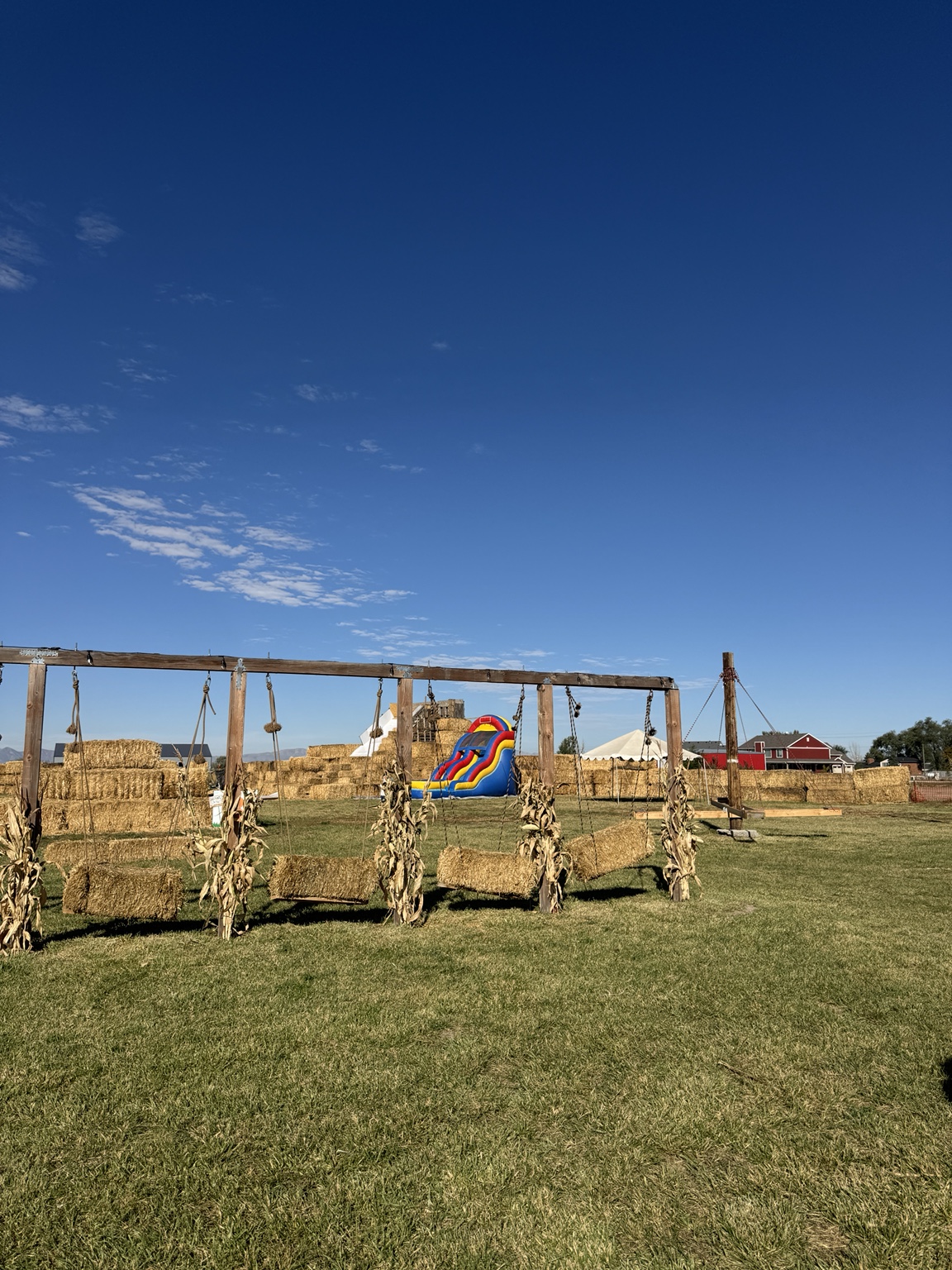 Hay-bale swings and inflatable slide at Hunt Family Farm