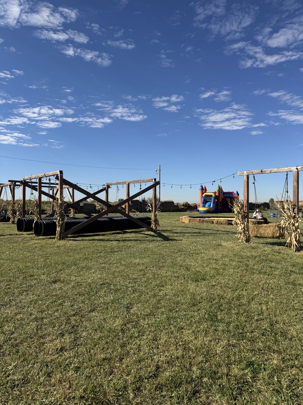 Hanging play tunnels and bounce house at Hunt Family Farm