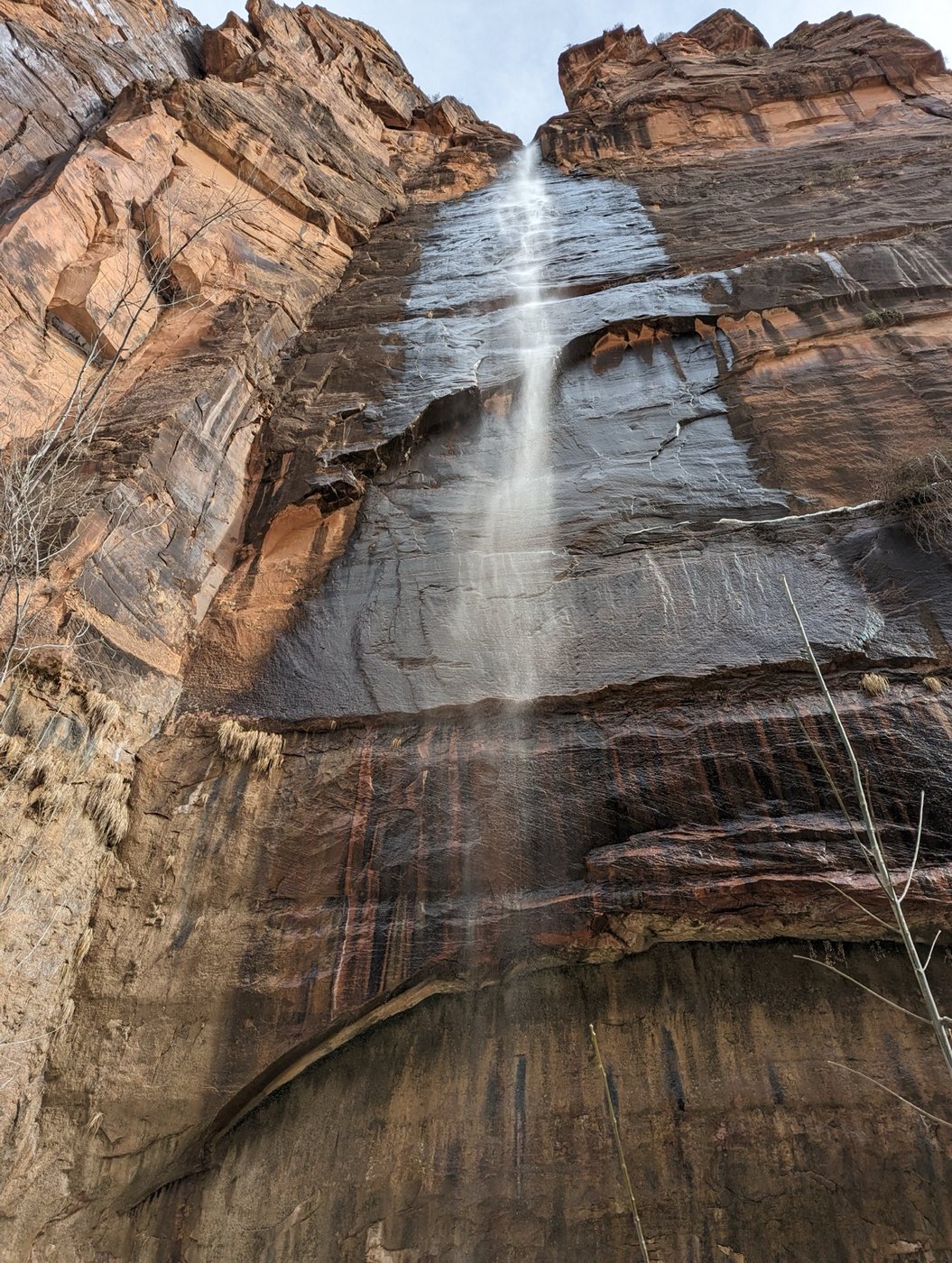 Waterfall spilling over the rock wall at Lower Emerald Pool