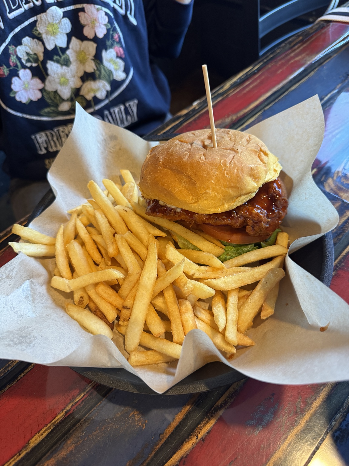 Sauced chicken sandwich and fries at Chubby’s