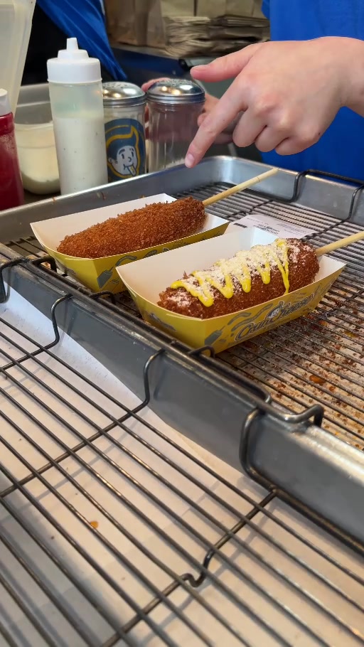Cruncheese corn dogs in paper trays at the preparation counter