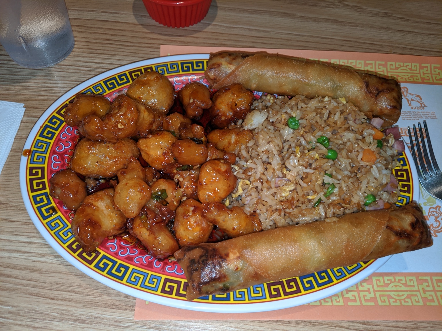 Crispy sauced chicken with fried rice and two egg rolls at La Choi’s