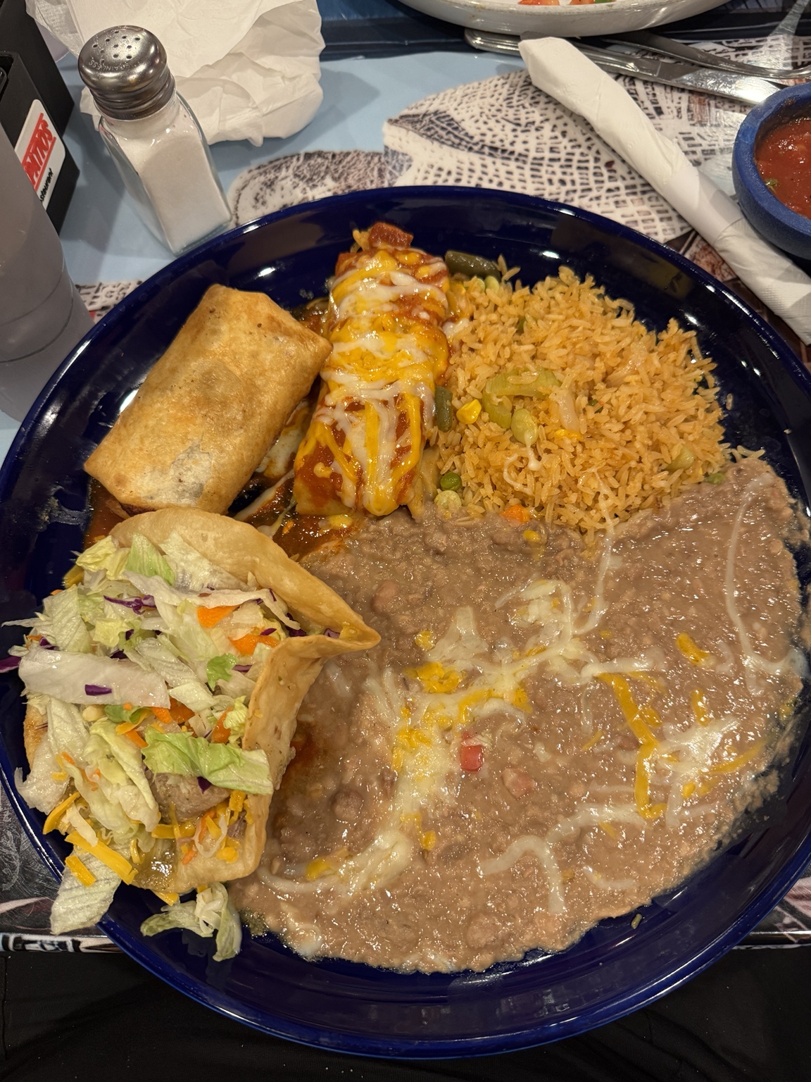 Mexican combination platter with taco, enchilada, rice, and beans at Los Tapatios